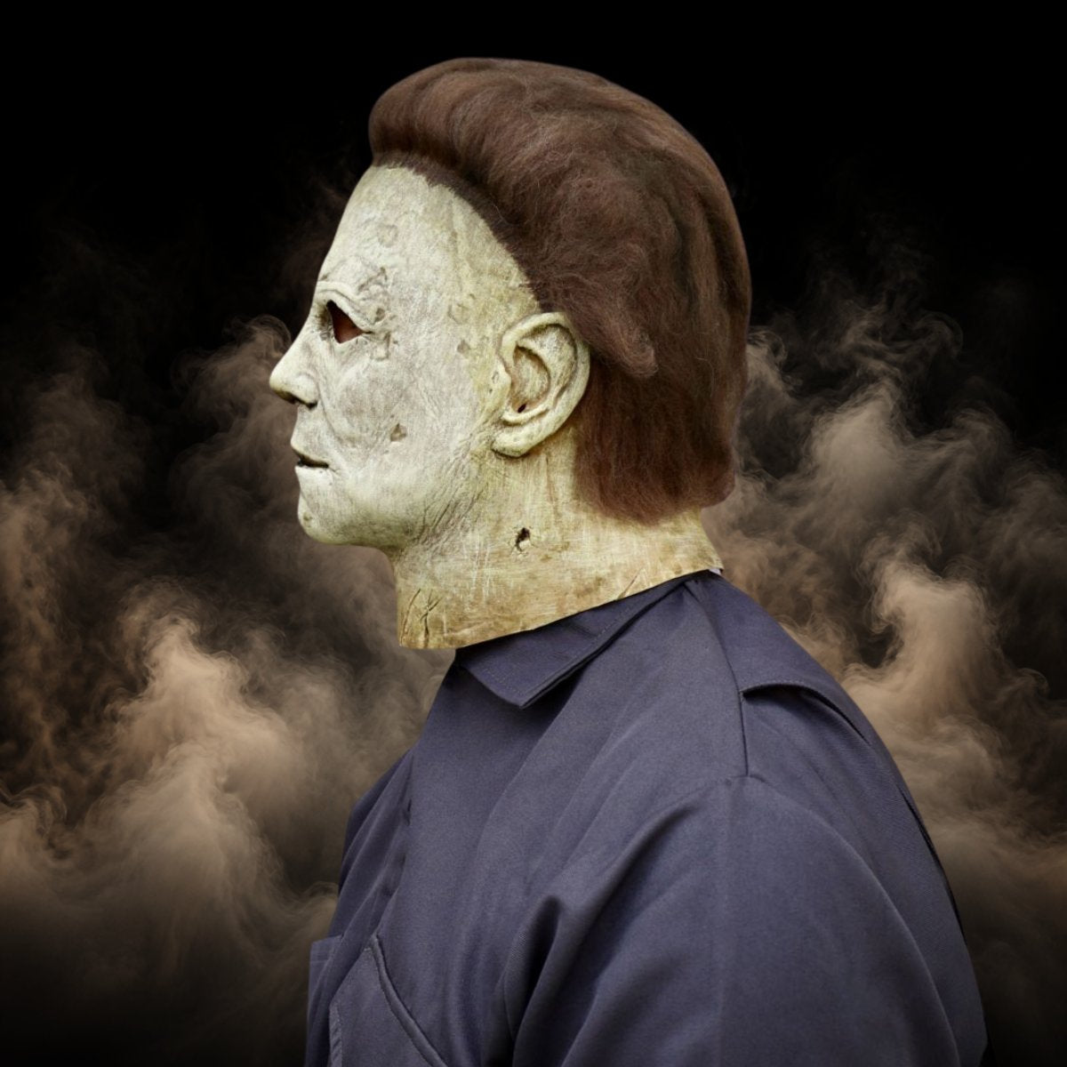 Side view of an off white slasher mask that pulls over the head
