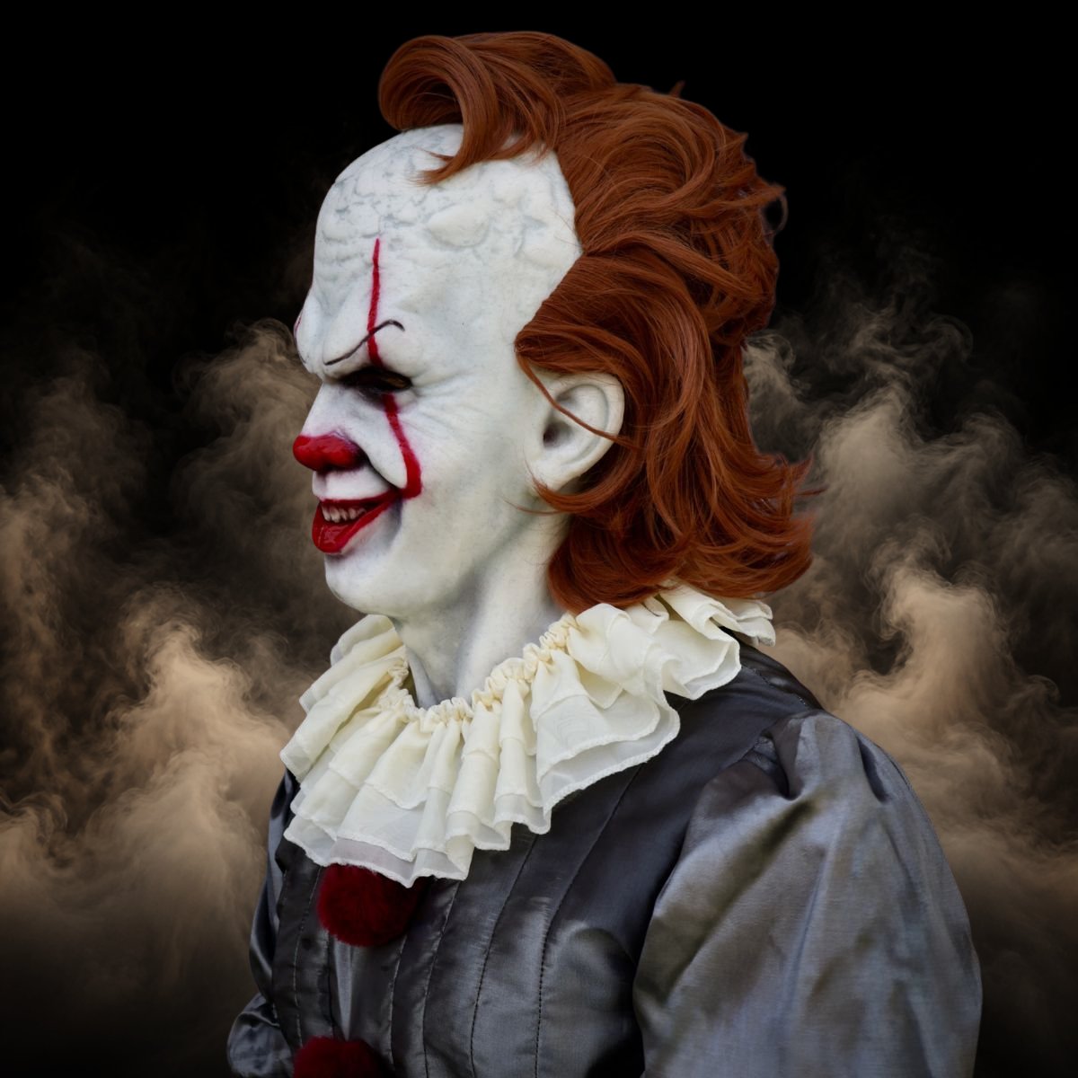 Three quarter view of an evil clown mask showing full head and neck coverage
