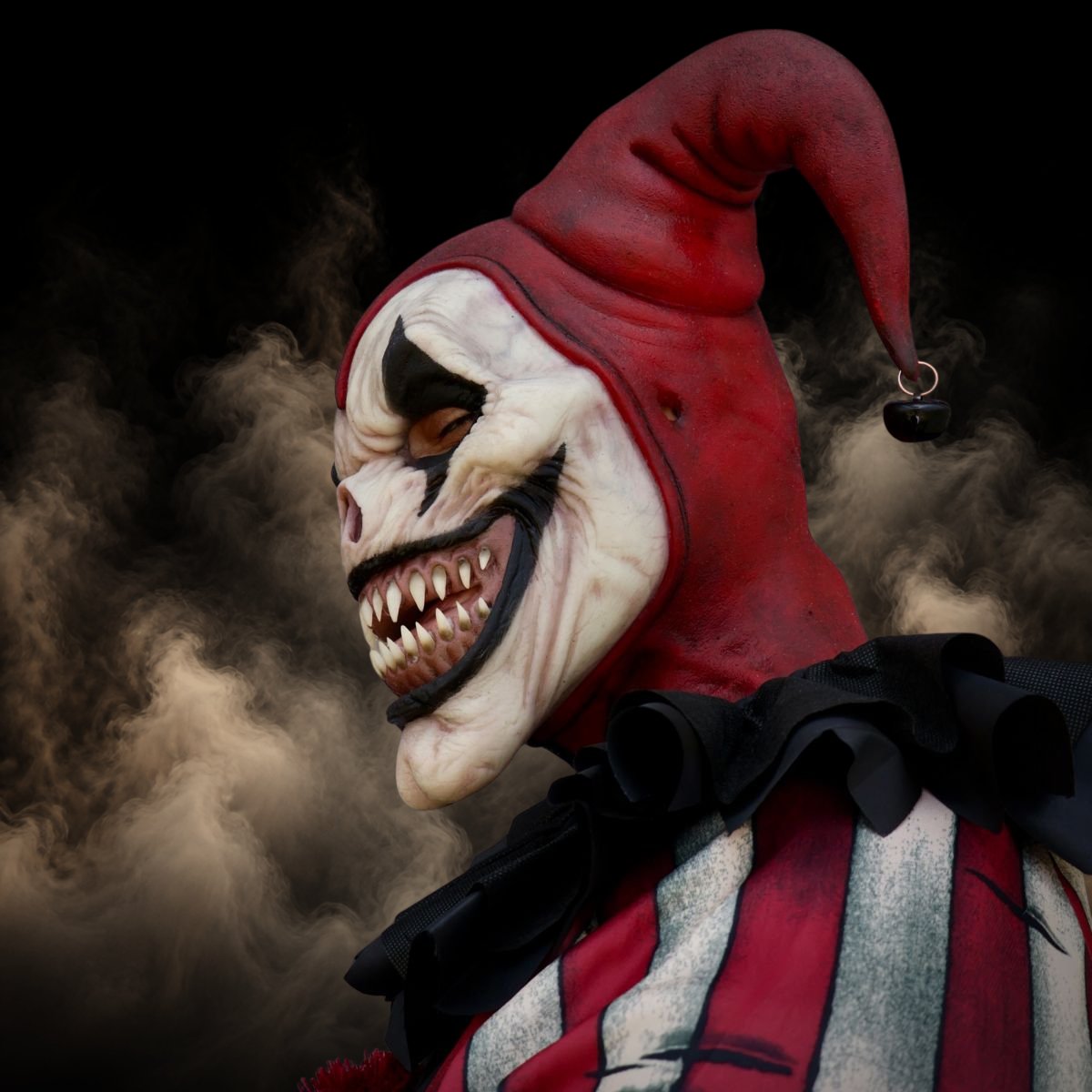 Side view of a jester clown mask showing full head and neck coverage
